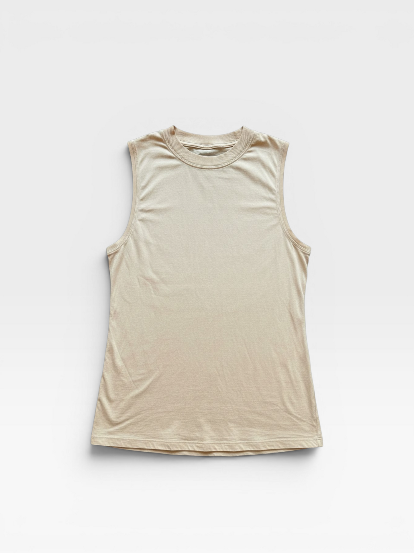 TheConsignmentBar Lululemon tan sleeveless tank top with a crew neckline and relaxed fit.